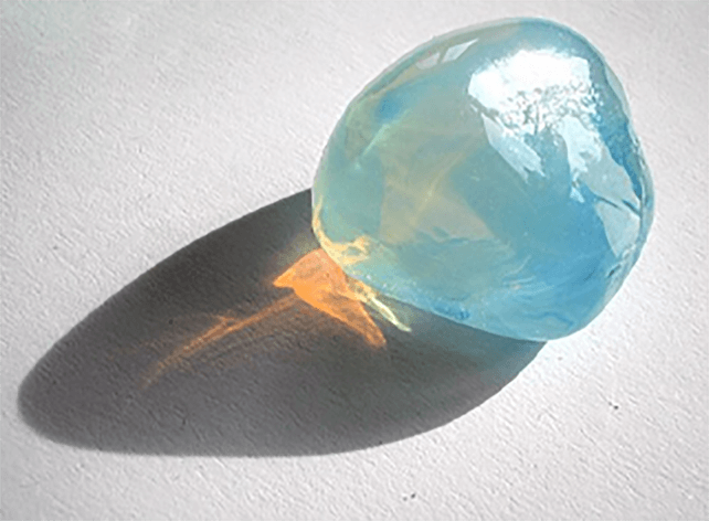 Rayleigh scattering in opalescent glass
